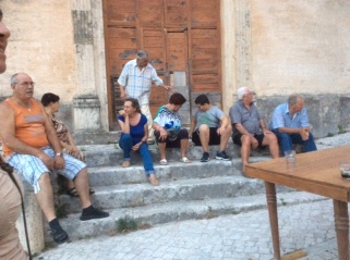 Neighborhood gathering for pizza on the piazza, Peschio, Italy
